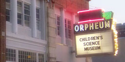 Illuminated marquee of the museum at twilight